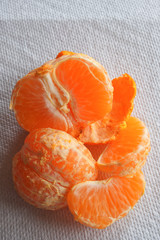 Peeled orange with pieces