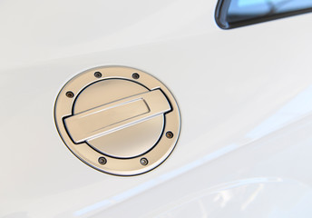 Closeup of fuel tank cover of white racing car