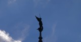 Statue of Angel against Blue Sky with Clouds Timelaps