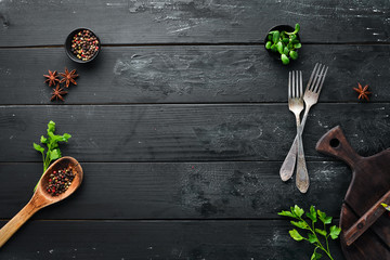 Cooking banner. Kitchen board, spices and cutlery. Top view. Free space for your text. Rustic style.