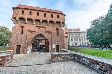 KRAKOW, POLAND - SEPTEMBER 30, 2017: Barbakan Krakovski with tourists. Cracow is a major city of Poland