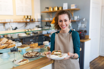 Waitress ready to serve food in cafe