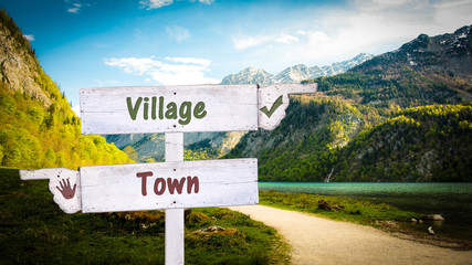 Street Sign Village versus Town