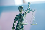 Statue of blind goddess Themis on blurred background