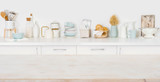 Empty wooden board with copyspace on defocused kitchen counter background