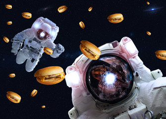 Astronauts in outer space with cheseburgers. Elements of this image furnished by NASA. Suitable for any purprose use