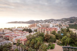 view from a hill side looking down at the town of almunecar