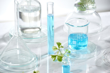 cosmetic laboratory research and development . science bio skincare cream serum product with leaves. natural organic beauty cosmetics concept. cosmetology.