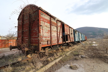   Abandoned old railway wagons at station, old train wagons in an abandoned station Inside this train station still stay wagons since the station was closed.