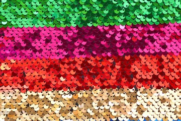 Sequins background.sequins striped fabric.Texture scales with Sequins close-up.Sequins multicolored stripe.Scales background.Shiny texture  material