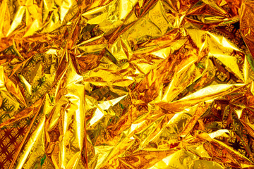 Bright yellow holographic foil background. Multicolor trendy