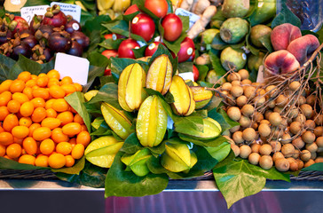 Fresh fruits in market. Exotic fresh fruits on a market,papaya, dragon fruit,passion fruit.