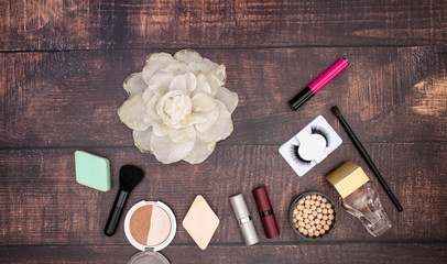 Make up beauty and cosmetics products for woman on wooden background 