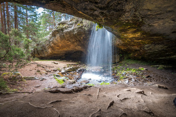 beautiful waterfall view from inside a cave