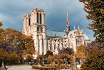 PARIS, FRANCE - JULY 2014: Exterior view of Notre Dame with tourists. This is the most visited landmark in France