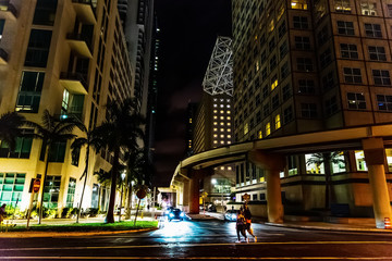 People in downtown Miami at night