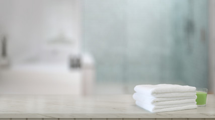 White towels on wood counter in modern bathroom