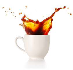 coffee spilling out of a cup isolated on white background