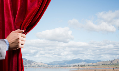 Summer natural bluesky view behind red velvet curtain