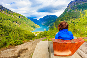 Tourist enjoying Geirangerfjord from viewing point