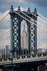 New York City, USA - June 7, 2010: Detail of the Manhattan Bridge with the Empire State Builing on the background, in the city of New York City.