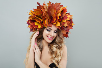 Autumn model woman. Pretty blonde girl in autumn leaves wreath
