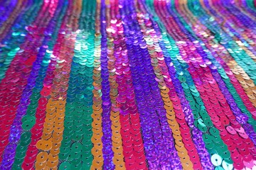 Sequins background.sequins striped fabric in cold tones.Texture scales with Sequins close-up.Sequins multicolored stripe.Scales background.Shiny texture sequin material