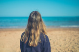 Young woman relaxing on the beach