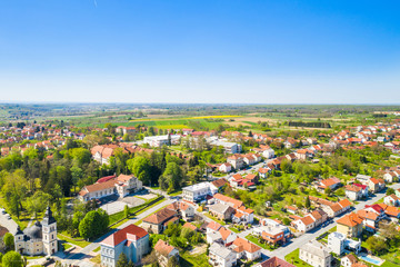 Croatia, Slavonia, town of Daruvar, main square and catholic church in spring, panoramic drone view