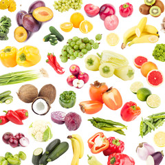 Background made from different colored vegetables and fruits, isolated on white