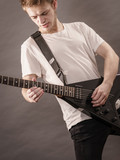 Man playing on electric guitar