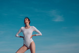 Adorable beauty. Classic dance style. Young ballerina dancing on blue sky. Cute ballet dancer. Pretty girl in dance wear. Practicing art of classical ballet. Concert performance dance, copy space