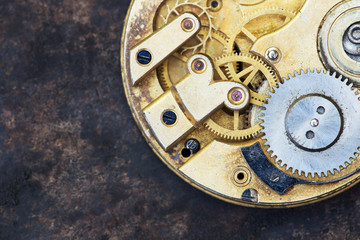 Vintage clock close-up, time mechanism with metal gears