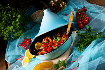 Tasty spicy beef with various vegetables cooked in tagine