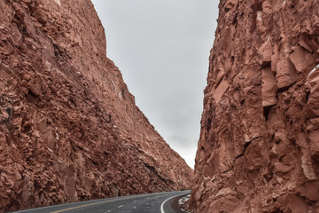 the road between reddish mountains 