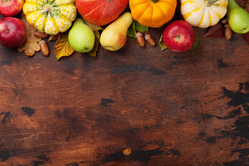 Autumn backdrop with pumpkins and fruits