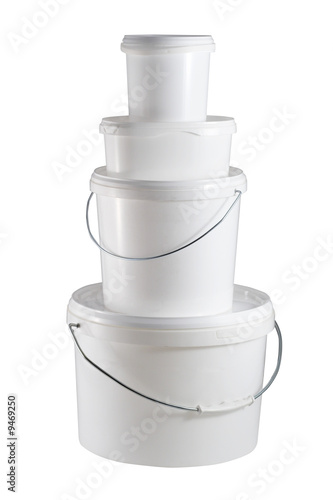 Four closed white plastic containers one on the another