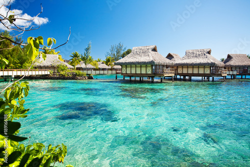 Fototapeta Over water bungalows with over amazing lagoon
