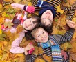 Children in autumn leaves