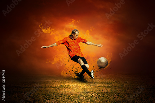 Fototapeta Football player on the field and fire