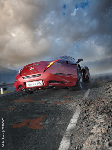 Fototapeta Red sports car moving on the mountain road