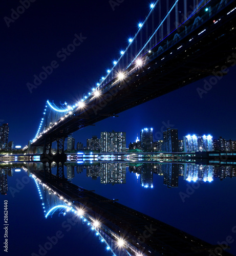  New York City Skyline and Manhattan Bridge At Night