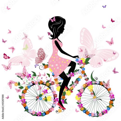 Fototapeta Girl on a bicycle with a romantic butterflies