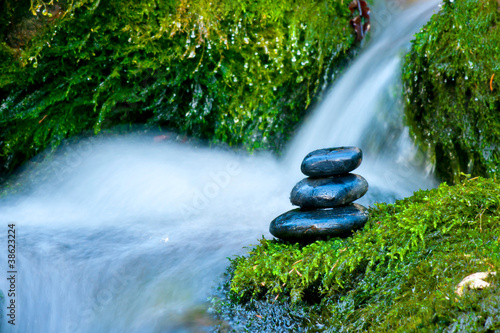 Fototapeta Pebble stones over waterfall