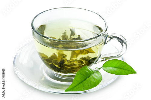 Fototapeta Cup with green tea and green leaves.