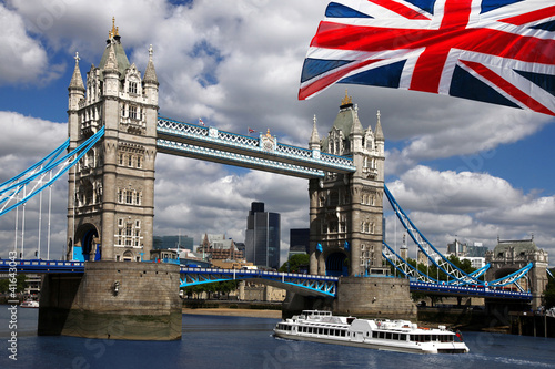 Lacobel Tower Bridge with boat and flag of England in London