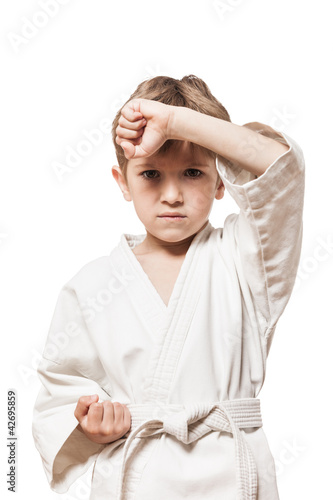 Child boy in kimono training karate © ia_64