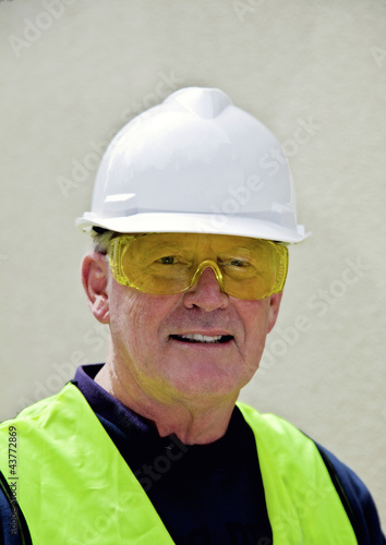 Building worker in <b>safety gear</b> - 400_F_43772869_ObWLxWv1bz9MU8qKtKO4HiJw8texpkg3