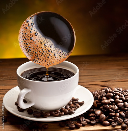  Coffee pours into the cup.