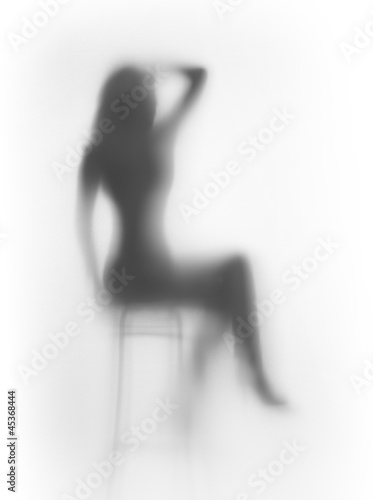 Fototapeta Diffuse sitting woman silhouette